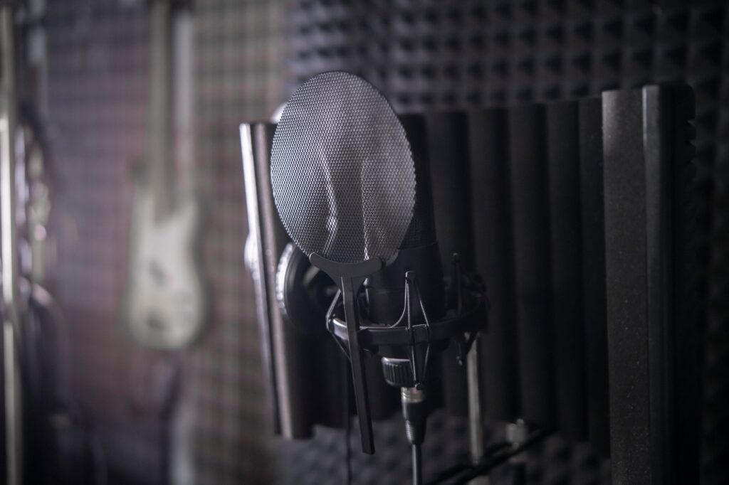 Acoustic treatment to remove background noise from vocal recordings.